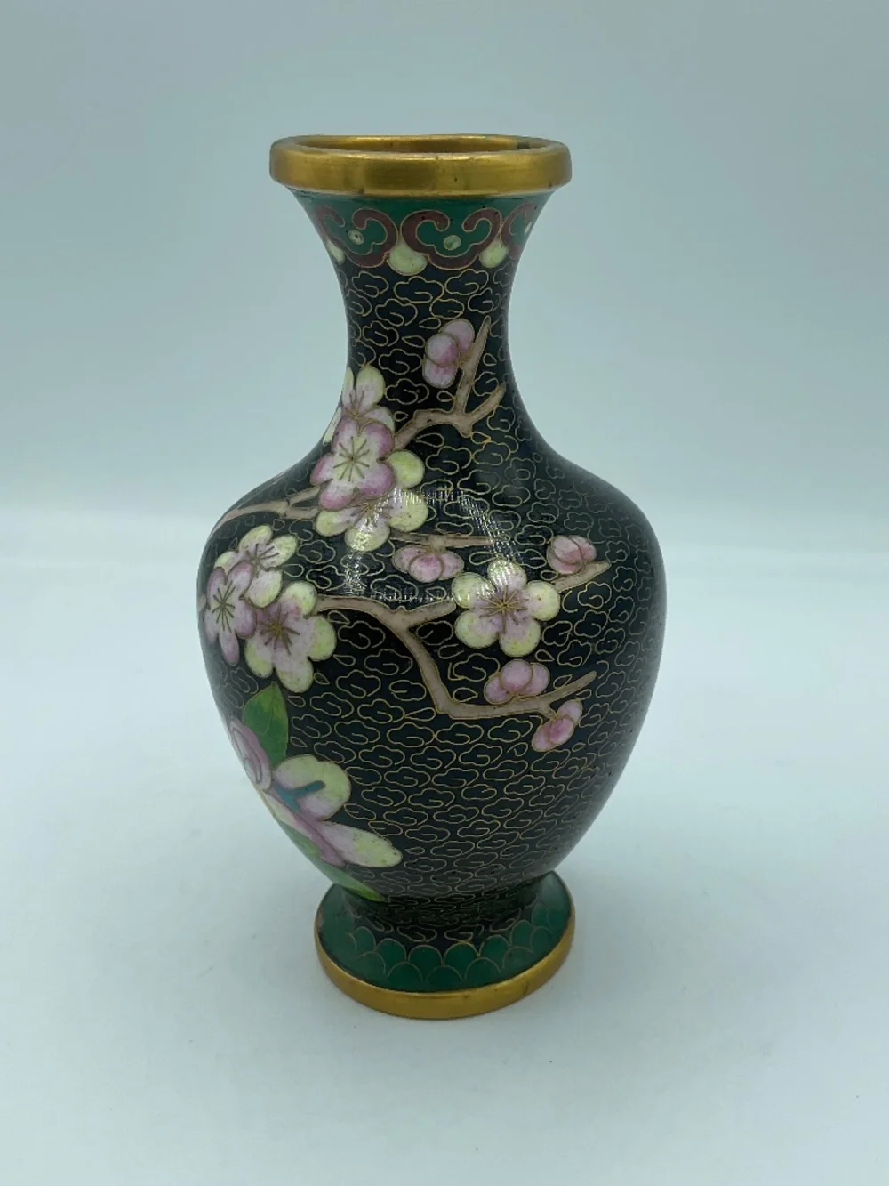 Chinese cloisonné enamel vase features a black background Floral Cherry Blossoms